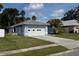 Single-story home with a two car garage and well-maintained lawn at 6928 43Rd E Ct, Sarasota, FL 34243