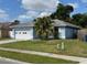 Single-story home with a two car garage and a well-maintained lawn at 6928 43Rd E Ct, Sarasota, FL 34243