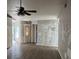 Open living room area with new wood flooring and large front door at 6928 43Rd E Ct, Sarasota, FL 34243