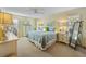 This main bedroom features a king bed, plenty of closet space, and coastal decor at 7311 7Th W Ave # 7311, Bradenton, FL 34209