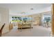 This living room is well-lit by a large window that brings the outside in, with lots of space for entertaining at 7311 7Th W Ave # 7311, Bradenton, FL 34209