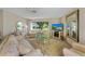 Well-lit living room with stylish furniture, large windows, and a cozy fireplace, perfect for relaxation and entertaining at 7311 7Th W Ave # 7311, Bradenton, FL 34209