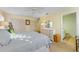 This main bedroom features a king bed, plenty of closet space, and coastal decor at 7311 7Th W Ave # 7311, Bradenton, FL 34209