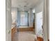 Bathroom showcasing dual vanity, soaking tub, and walk-in shower at 8005 Royal Birkdale Cir, Lakewood Ranch, FL 34202