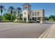 Community entrance featuring a guard house with decorative architecture and well manicured landscaping at 8005 Royal Birkdale Cir, Lakewood Ranch, FL 34202