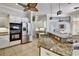 Kitchen featuring stainless steel appliances, granite countertops, and a large island with a sink at 8005 Royal Birkdale Cir, Lakewood Ranch, FL 34202