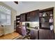 Well-appointed office space with custom built-in shelving, perfect for remote work or study at 8005 Royal Birkdale Cir, Lakewood Ranch, FL 34202