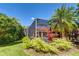 Backyard pool is screened-in and surrounded by lush, tropical landscaping at 8005 Royal Birkdale Cir, Lakewood Ranch, FL 34202