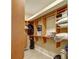 Spacious walk-in closet with built-in shelving and ample storage space at 8005 Royal Birkdale Cir, Lakewood Ranch, FL 34202
