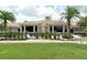 Attractive community clubhouse featuring a well-maintained lawn and manicured landscaping at 803 Fairwaycove Ln # 102, Bradenton, FL 34212