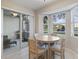 Cozy dining area featuring a bay window with views of the lush outdoor landscape at 803 Fairwaycove Ln # 102, Bradenton, FL 34212