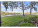 Picture-perfect view of the manicured golf course, showcasing lush greenery and blue skies at 803 Fairwaycove Ln # 102, Bradenton, FL 34212