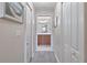 A hallway view showing bedroom access to a bathroom at 803 Fairwaycove Ln # 102, Bradenton, FL 34212