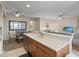 Modern open-concept kitchen with stainless steel appliances and adjoining dining and living spaces at 803 Fairwaycove Ln # 102, Bradenton, FL 34212
