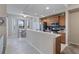 Modern kitchen featuring sleek appliances, a breakfast bar, and a bright dining area at 803 Fairwaycove Ln # 102, Bradenton, FL 34212