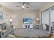 Comfortable living room with large sectional sofa, ceiling fan, and access to outdoor patio at 803 Fairwaycove Ln # 102, Bradenton, FL 34212