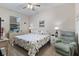 Cozy main bedroom features a queen-size bed, soft lighting, and calming decor at 803 Fairwaycove Ln # 102, Bradenton, FL 34212