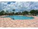 Community pool with lounge seating for residents to enjoy the sun and water at 803 Fairwaycove Ln # 102, Bradenton, FL 34212