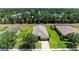 Aerial view of a well-manicured home with a pristine lawn and landscaped yard at 9819 46Th E Ct, Parrish, FL 34219