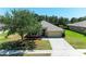 Well-maintained single Gathering home featuring a two-car garage and landscaped front yard at 9819 46Th E Ct, Parrish, FL 34219