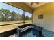 Relaxing screened lanai with seating and view of the backyard at 9819 46Th E Ct, Parrish, FL 34219