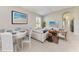 Bright living room with modern decor, an open floor plan, and a large painting at 9819 46Th E Ct, Parrish, FL 34219
