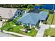 An aerial shot of the home with landscaped front yard, new roof and screened in pool at 1008 83Rd Nw St, Bradenton, FL 34209