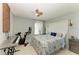 A cheerful bedroom complete with Peloton, keyboard, TV, and ceiling fan at 1008 83Rd Nw St, Bradenton, FL 34209