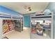 Fun bedroom featuring bunk beds, playful decor, beach mural, storage shelves, and a ceiling fan at 1008 83Rd Nw St, Bradenton, FL 34209