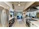 Modern eat-in kitchen with stainless steel appliances, and access to the living and pool area at 1008 83Rd Nw St, Bradenton, FL 34209