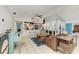Open-concept living room flows seamlessly into the kitchen and features coastal decor at 1008 83Rd Nw St, Bradenton, FL 34209