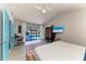 Cozy main bedroom with a view of the pool, a private workspace, and stylish blue doors to a private retreat at 1008 83Rd Nw St, Bradenton, FL 34209
