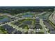 Sprawling community aerial showcasing homes surrounding a central lake and recreational area at 11713 Chevelon Ln, Parrish, FL 34219