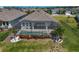 Aerial view of a backyard featuring a pool, screened lanai, and well maintained landscaping at 11713 Chevelon Ln, Parrish, FL 34219
