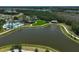 Aerial view of a community with walking paths, lakes, a pool and community buildings at 11713 Chevelon Ln, Parrish, FL 34219