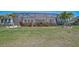 Large backyard with a screened lanai and decorative landscaping at 11713 Chevelon Ln, Parrish, FL 34219