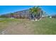 Expansive backyard includes a screened lanai with decorative landscaping at 11713 Chevelon Ln, Parrish, FL 34219