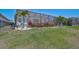 Well-maintained backyard features decorative landscaping and a screened enclosure at 11713 Chevelon Ln, Parrish, FL 34219