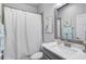 Bathroom featuring a shower with a white curtain, a vanity, and stylish coastal decor at 11713 Chevelon Ln, Parrish, FL 34219