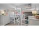 bedroom featuring white bunk beds with built-in desks and coastal decor at 11713 Chevelon Ln, Parrish, FL 34219
