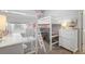 Charming bedroom featuring white bunk beds with desks and coastal-themed decor at 11713 Chevelon Ln, Parrish, FL 34219