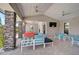 Inviting outdoor community area with comfortable seating, ceiling fans, and stylish stone columns at 11713 Chevelon Ln, Parrish, FL 34219