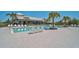 The resort-style community pool area features palm trees, ample seating, and sparkling water at 11713 Chevelon Ln, Parrish, FL 34219