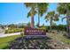 A beautiful sign and well-maintained landscaping welcome you to Riverfield Verandah at 11713 Chevelon Ln, Parrish, FL 34219