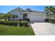 Charming single-Gathering home featuring a well-manicured lawn and a two-car garage with curb appeal at 11713 Chevelon Ln, Parrish, FL 34219