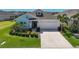 Attractive single-Gathering home showcasing well-maintained landscaping and a convenient two-car garage at 11713 Chevelon Ln, Parrish, FL 34219
