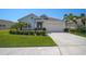 Charming single-Gathering home with a well-manicured lawn and a neatly maintained front yard landscaping at 11713 Chevelon Ln, Parrish, FL 34219