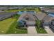 Charming single-story home with a well-maintained lawn, lush landscaping, and inviting curb appeal at 11713 Chevelon Ln, Parrish, FL 34219