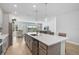 Bright kitchen featuring stainless steel appliances, a central island, and an open-concept layout at 11713 Chevelon Ln, Parrish, FL 34219