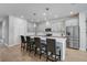 Bright kitchen featuring a large island with bar seating, stainless appliances, and ample cabinet space at 11713 Chevelon Ln, Parrish, FL 34219